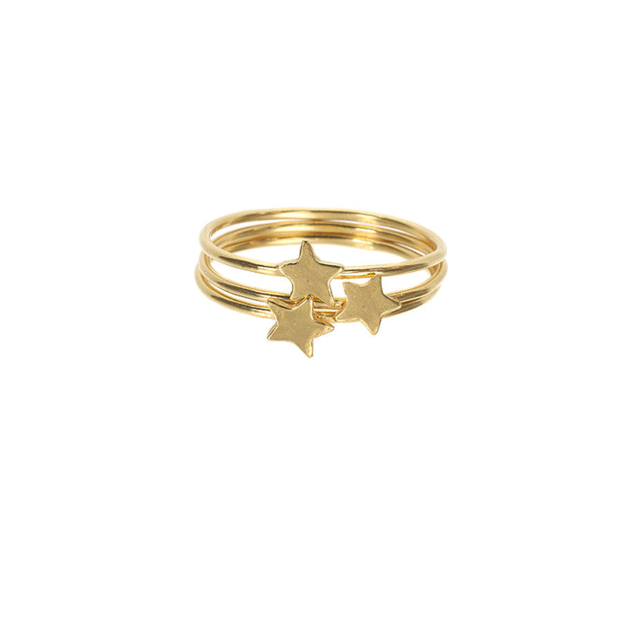 Star Stacking rings in gold, featuring three band rings with shiny stars sitting on top. 