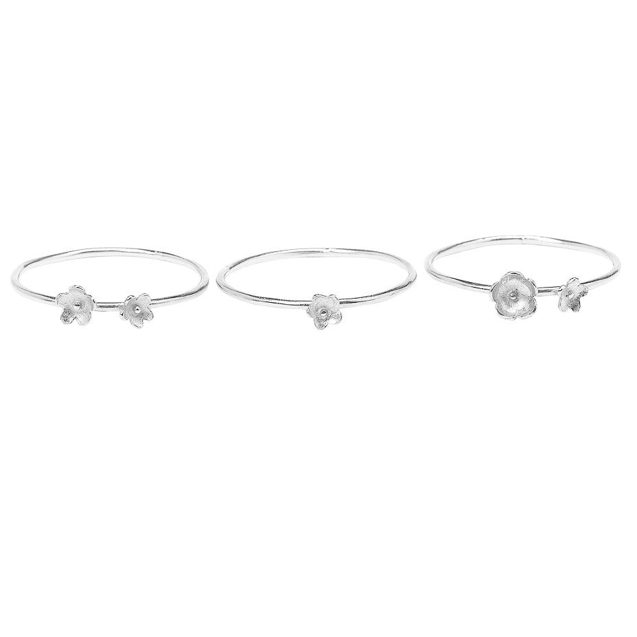 Summer Breeze Flower Stacking rings in silver, made from three rings each decorated with tiny flowers.