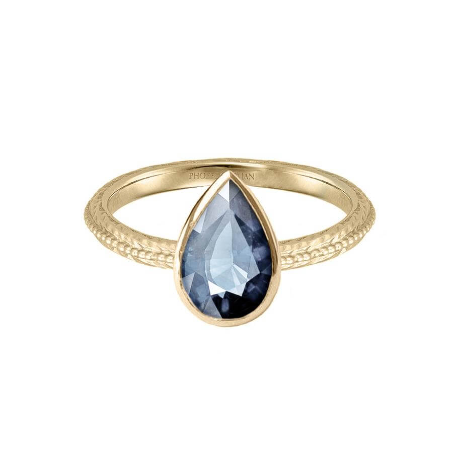 Pear shaped Harmony engagement ring in 18 carat yellow gold, with a blue grey sapphire.
