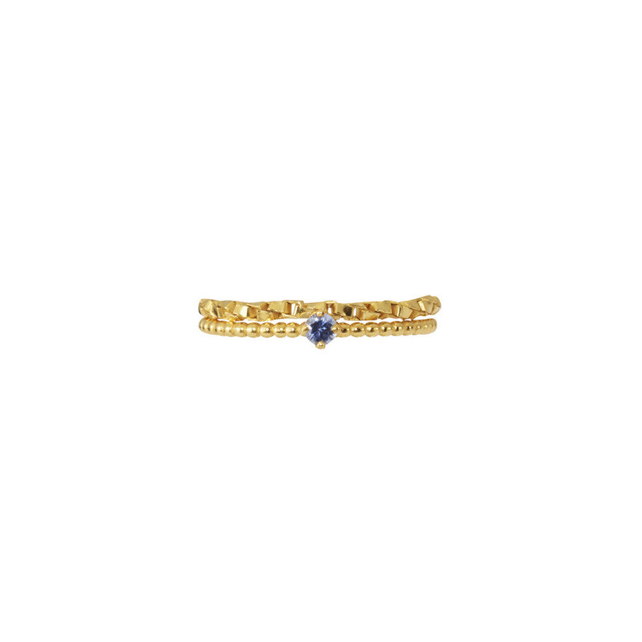 We've paired our dainty beaded Forget-Me-Not Blue Sapphire gold ring with our Chain Reaction Ring for a modern take on a a timeless classic.