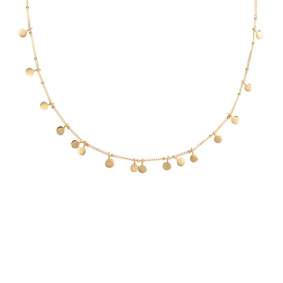 The gold Fortune Teller Coin necklace has 16 smooth and sparkling tiny coins that glide between the baubles on our shiny ball and curb chain. 