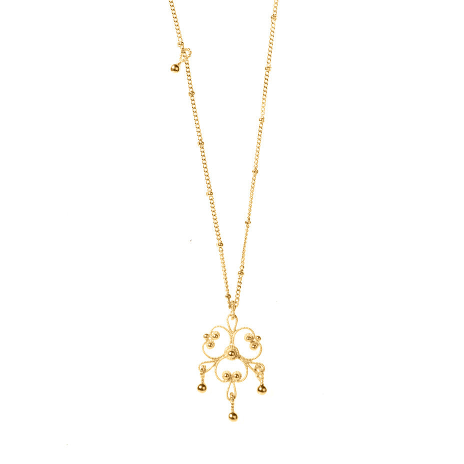 Gypsy Chandelier Long necklace in gold, featuring intricate lace-like designs inspired by traditional gypsy dresses.