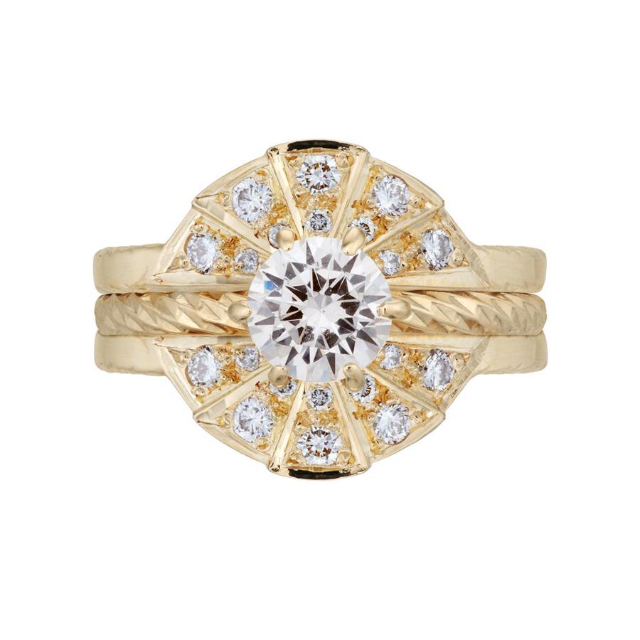 The Rays of Light solitaire engagement ring and white diamond sunbeam wedding band in a full set. Made from 18 carat yellow gold.