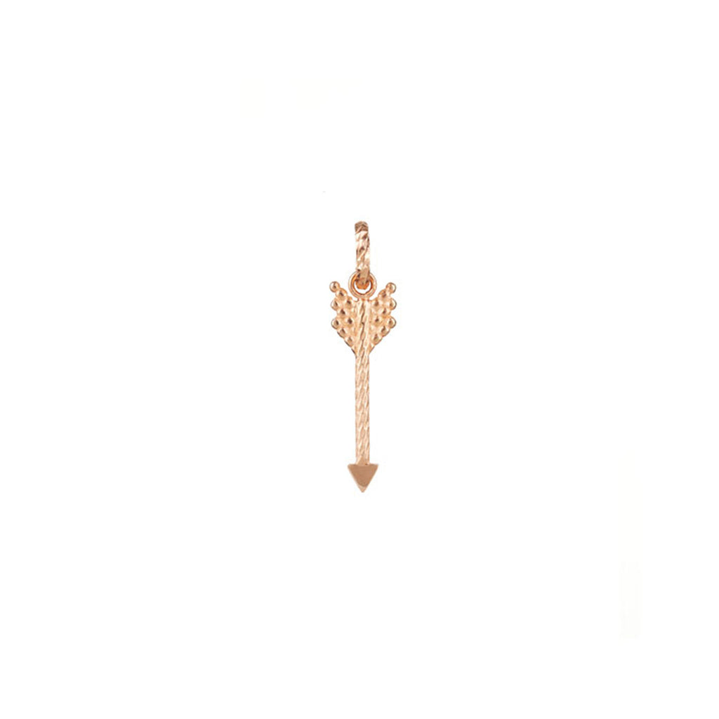 Strength Arrow charm in rose gold.