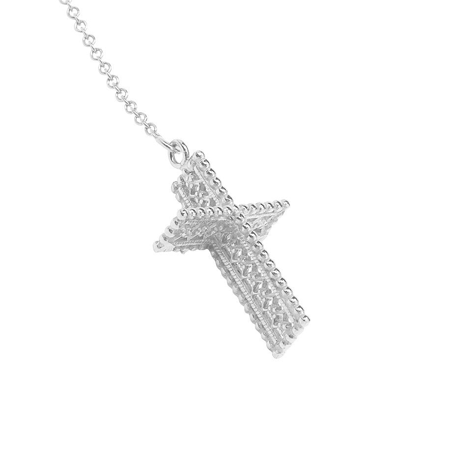 Angel Wing and Cross Lariat necklace in silver, featuring a 3-d lace effect cross hanging beneath a delicate angel wing. Cross close-up. 