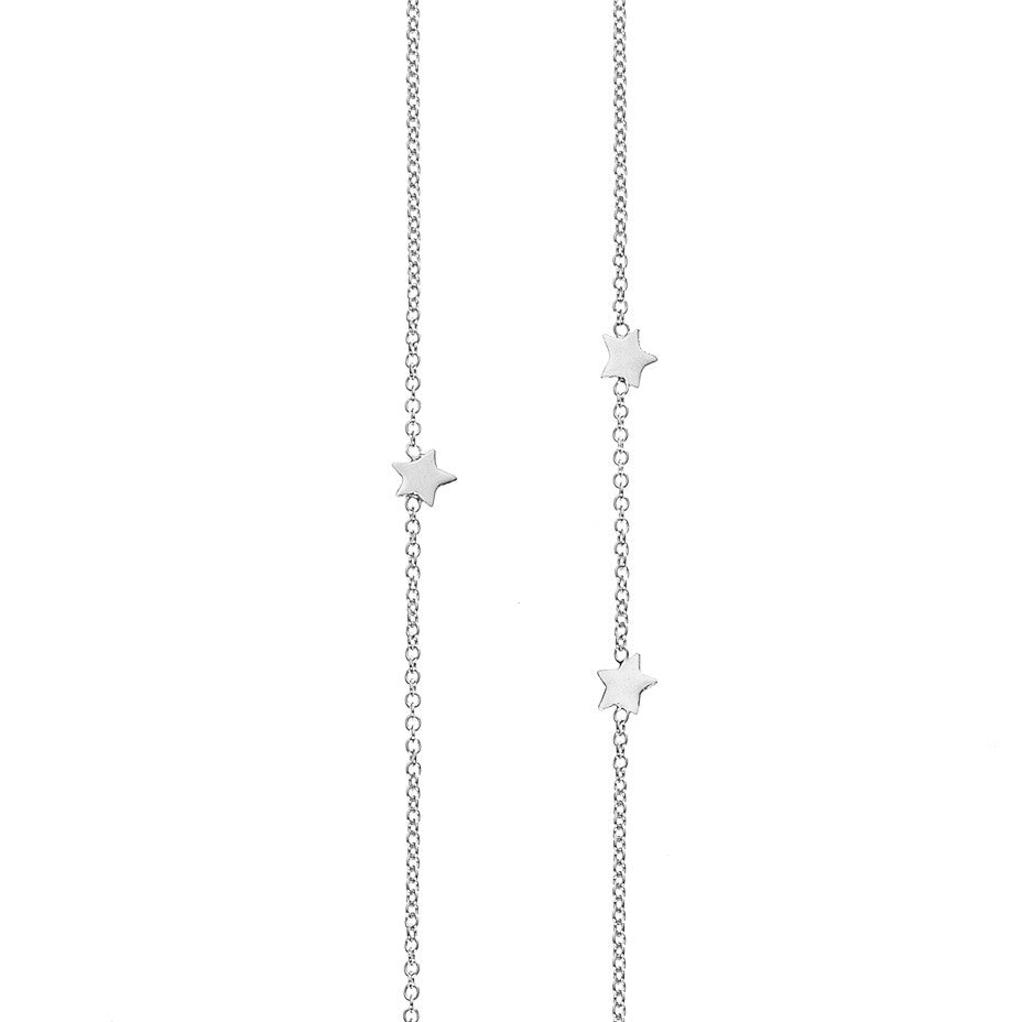Eleven Star Long necklace in silver, featuring eleven shiny stars inserted into a chain in a random scatter to represent the night sky. 