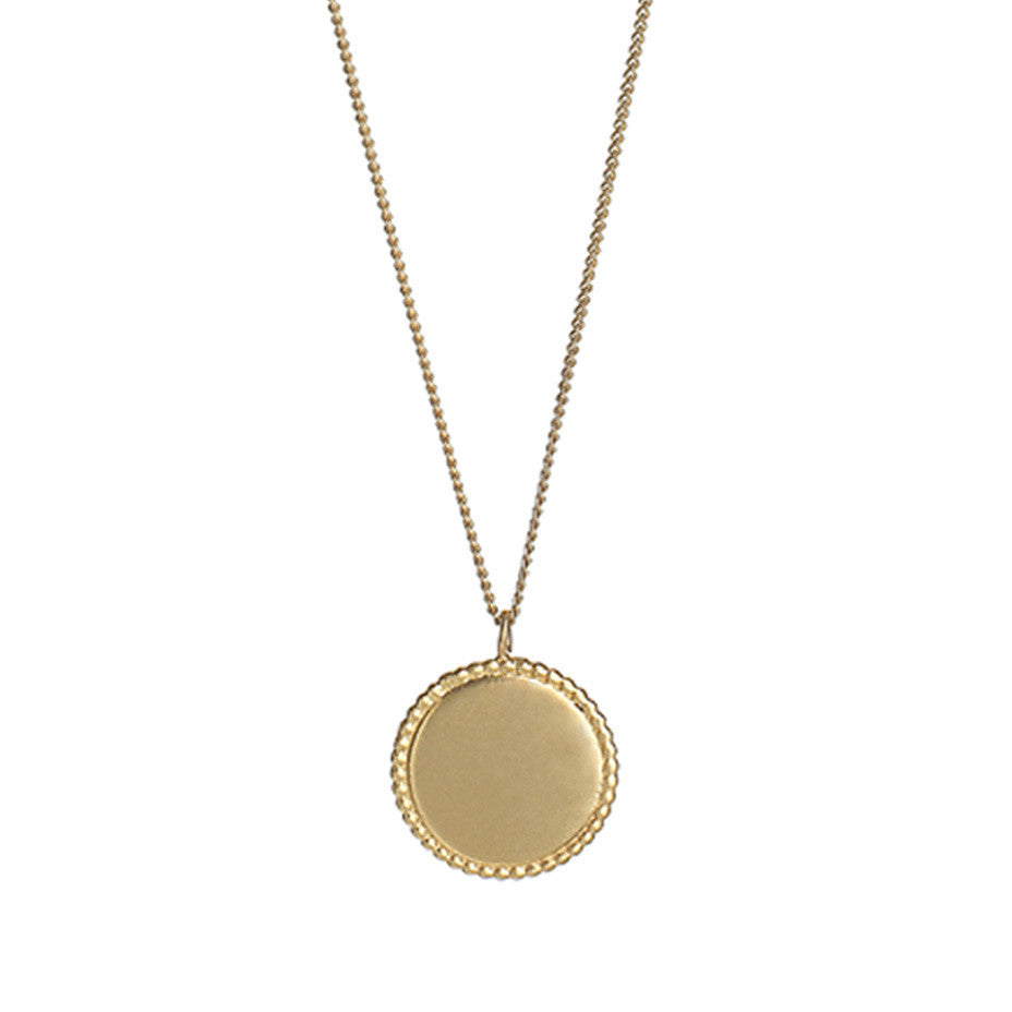 The Roman Disc necklace in gold, finished with a brushed satin.