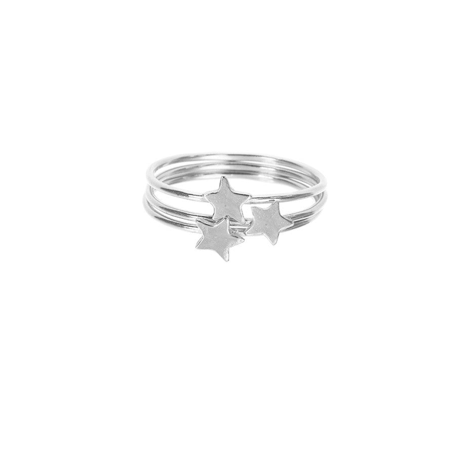 Star Stacking rings in silver, featuring three band rings with shiny stars sitting on top. 