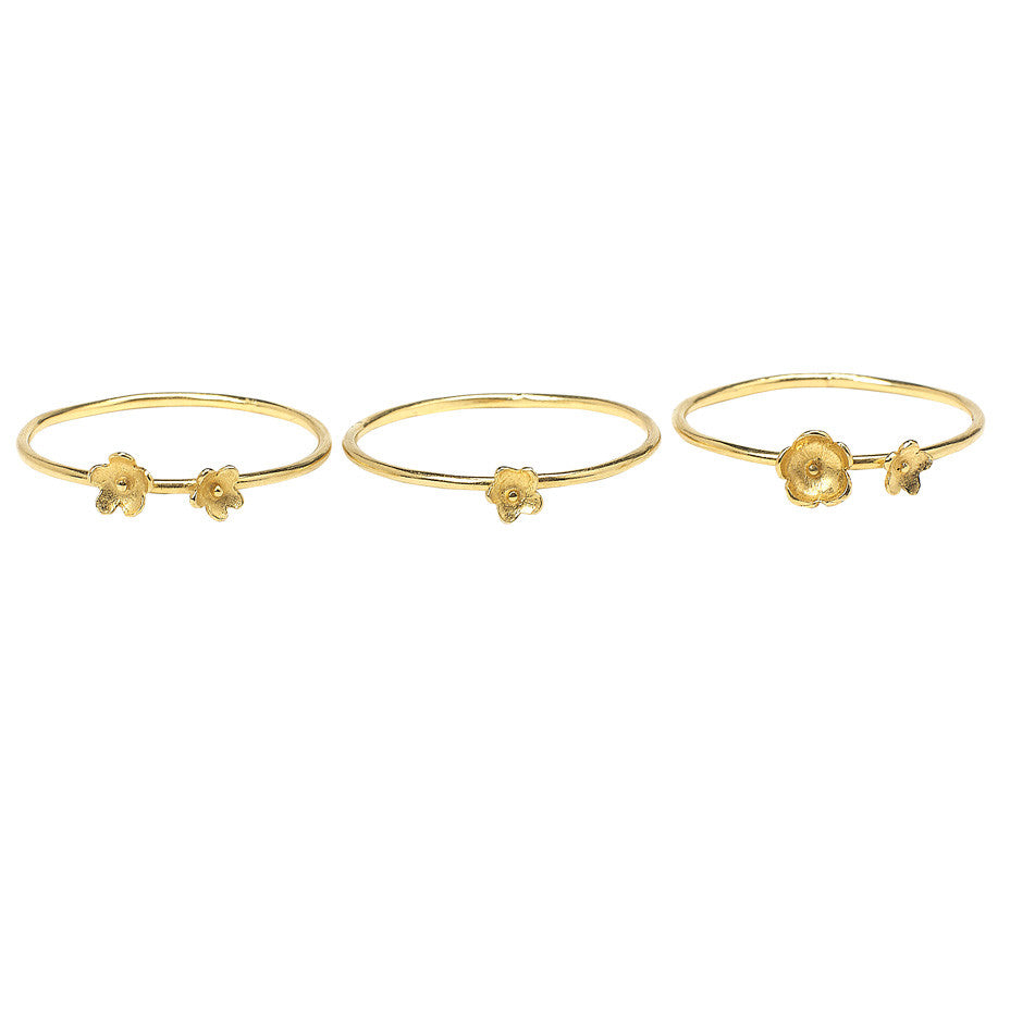 Summer Breeze Flower Stacking rings in gold, made from three rings each decorated with tiny flowers.