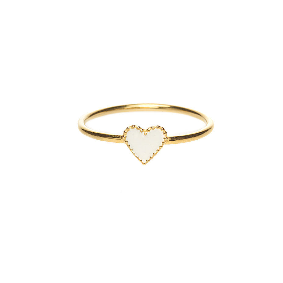 The White Enamel Heart ring in gold, elegant and sophisticated all at the same time.