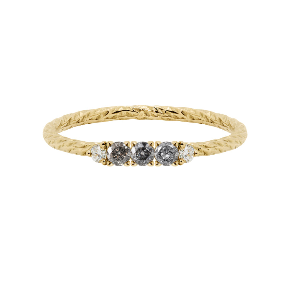 Salt & pepper diamond birthstone ring with two white diamond side stones on a textured gold band. 