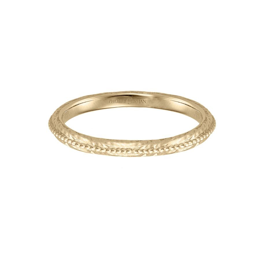 Eternal wedding band in 18 carat yellow gold, featuring a textured band with a beaded line across the centre.