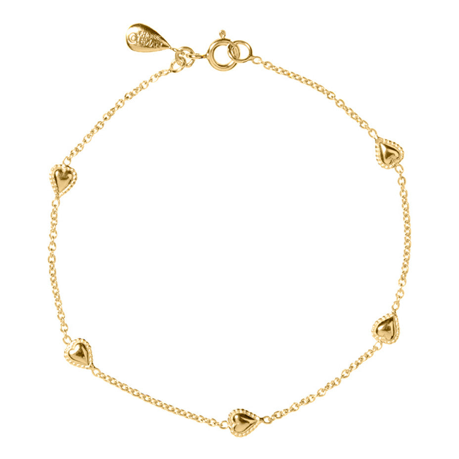 Gypsy Heart Bracelet in gold, featuring five tiny hearts, encapsulated by our signature beaded wire, interspersed on a fine gold chain.