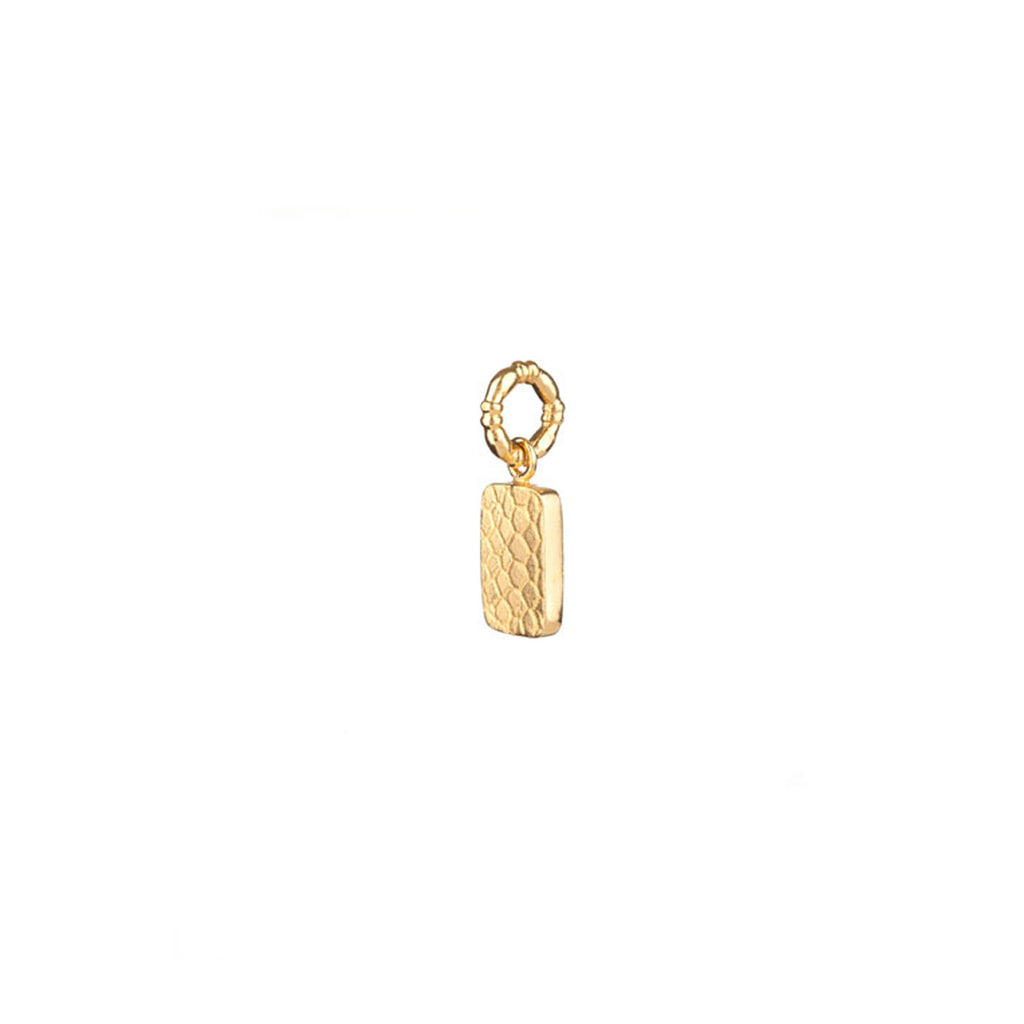 Mini Nugget charm in gold, featuring a bite size tablet of gold with a snake skin scale print engraved into the surface.
