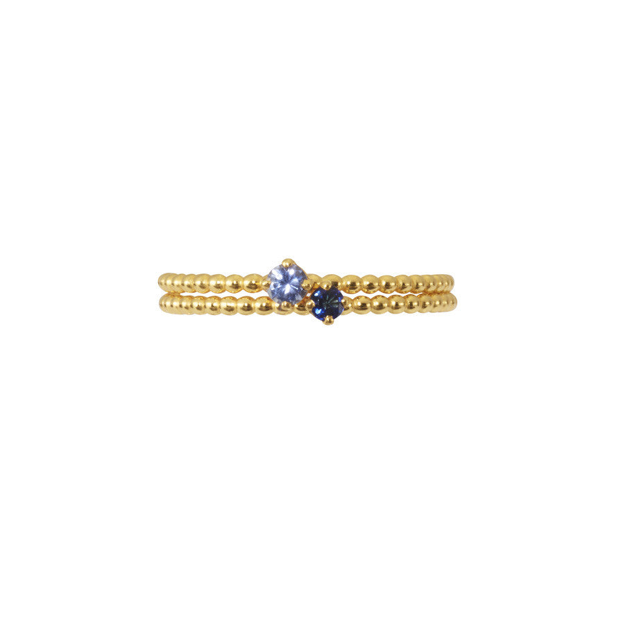 Our Forget-Me-Not blue and Royal Blue sapphires adorn our signature beaded bands in gold.
