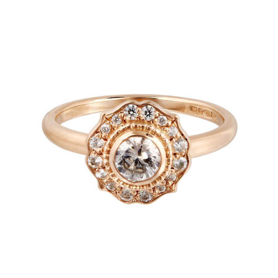 The Paradise white diamond halo engagement ring has a traditional vintage feel with a modern edge. Made from 18 carat rose gold. 