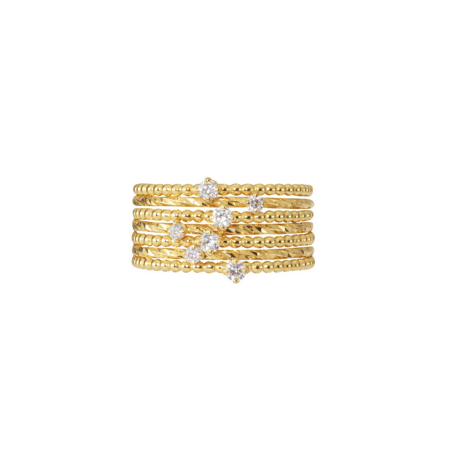 Purist Stacking Set in gold, a combination of baby and lily white diamond rings.