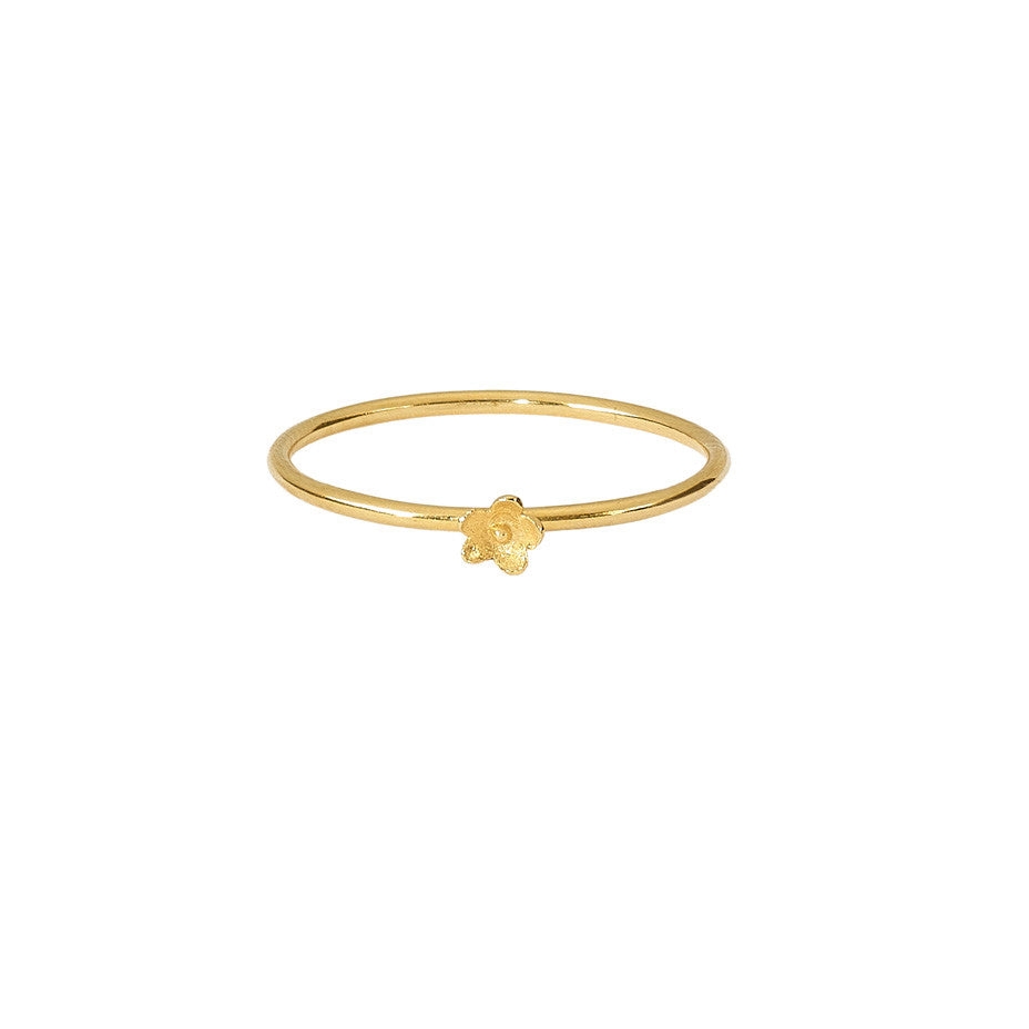 Flower Stacking ring in gold, featuring a smooth band and the prettiest little flower.