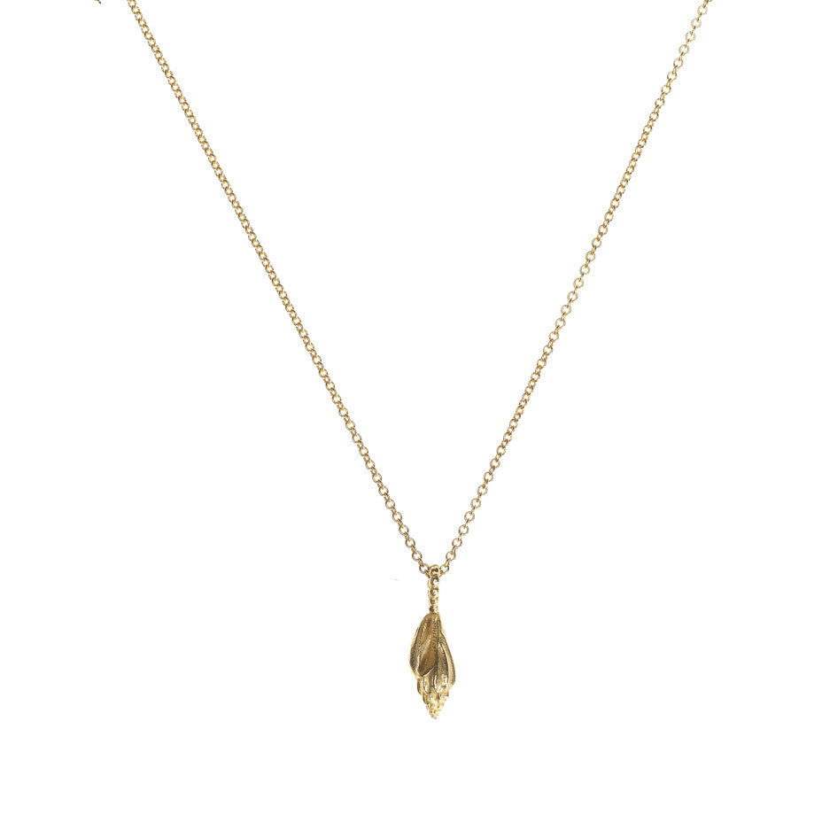 Sound Of The Sea necklace in gold, fashioned from a tiny shell.