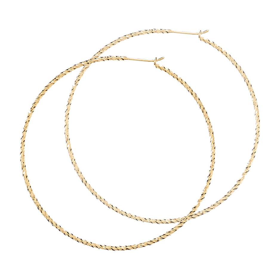 Sparkling Large Hoop earrings in gold, fashioned from our signature diamond cut wire.