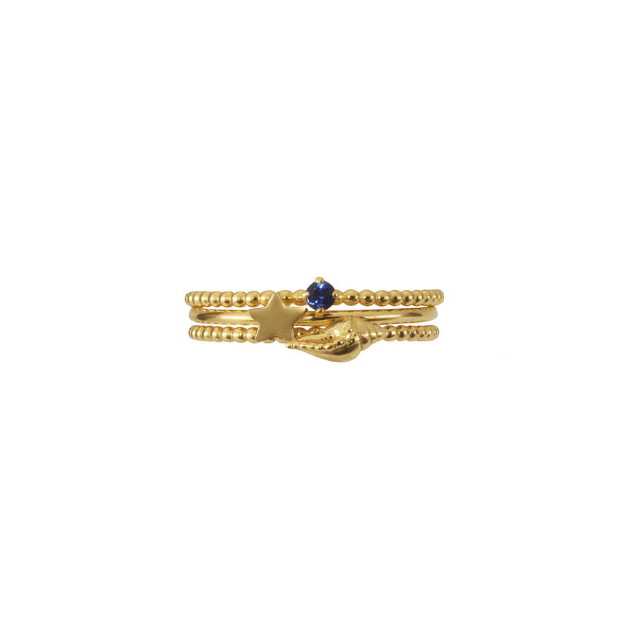 Shell, Star and Sapphire Stacking Trio in gold.