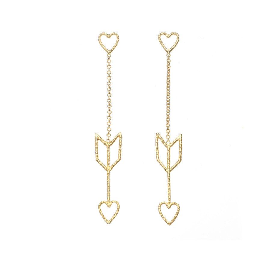 Arrow Of Love earrings in gold. The heart and arrow are attached to each other by delicate gold chain.